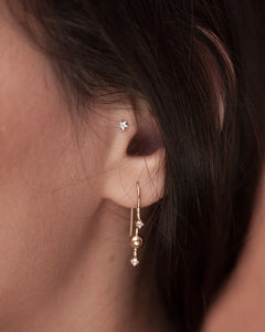 Gold plated silver hook earring Venus Stars from Kinz Kanaan. Set with cubic zirconiuas. Festive sparkly earrings.